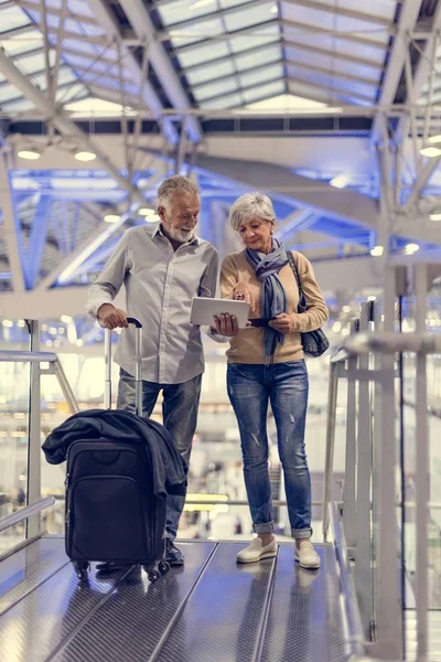 Senior couple in airport terminal