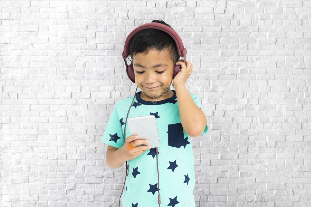 Boy listening music in earphones