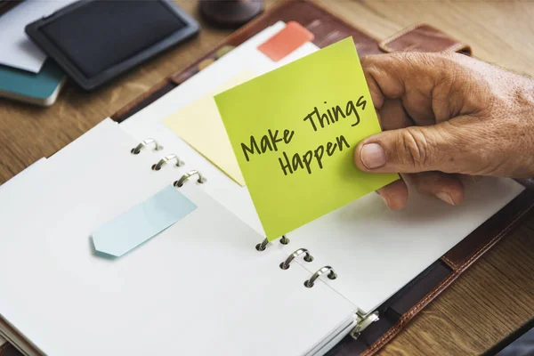 Person holding yellow stick note — Stock Photo, Image