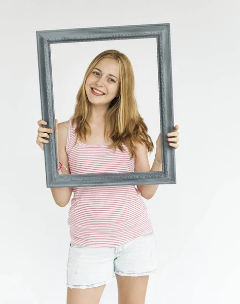 Woman holding picture frame — Stock Photo, Image