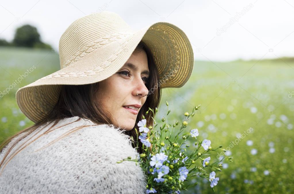Woman holding wildflowers