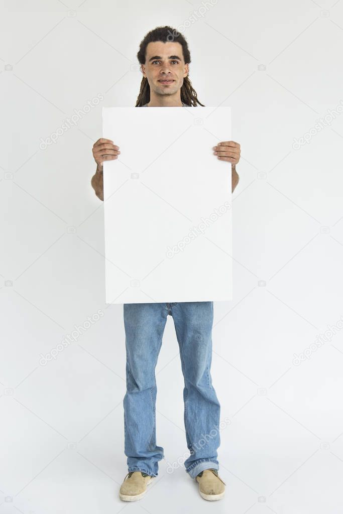 man with dreadlocks holding paper 