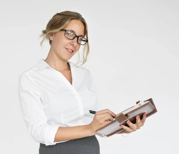 Businesswoman writing notes — Stock Photo, Image