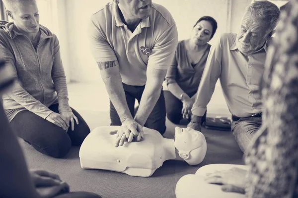 People learning CPR First Aid Training
