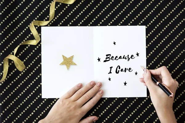 Person writing on greeting card — Stock Photo, Image