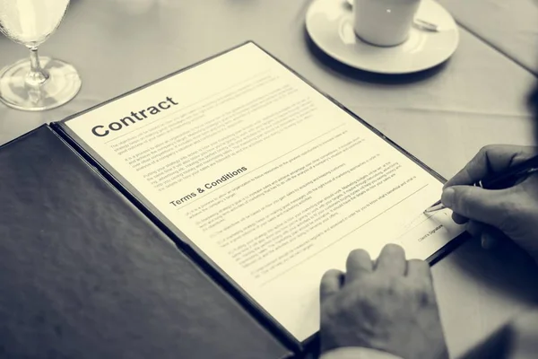 person signing company contract