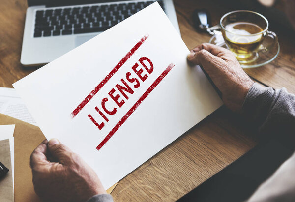 person holding paper with text