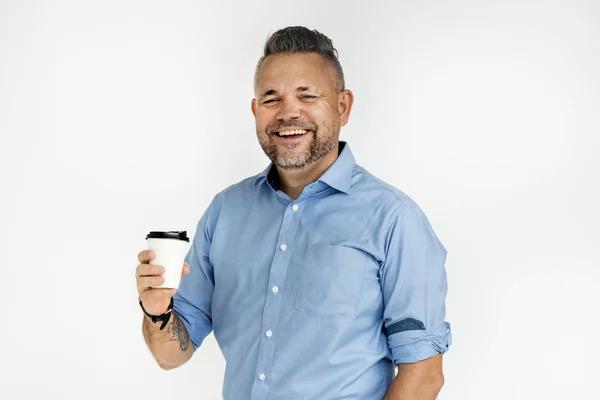 Homem segurando xícara de café — Fotografia de Stock