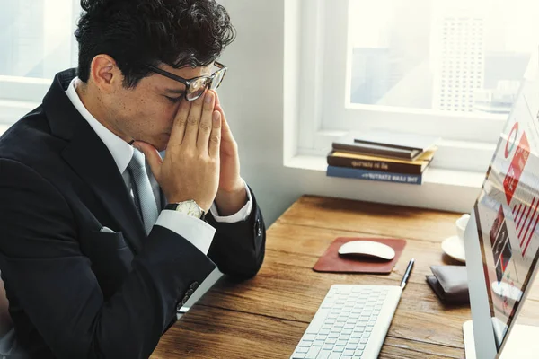 Tired Businessman at computer monitor — Stock Photo, Image