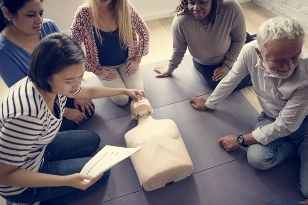 People learning CPR First Aid Training