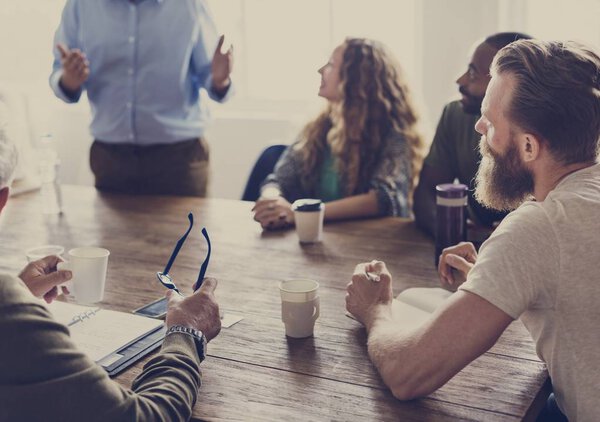 Diverse people on meeting table