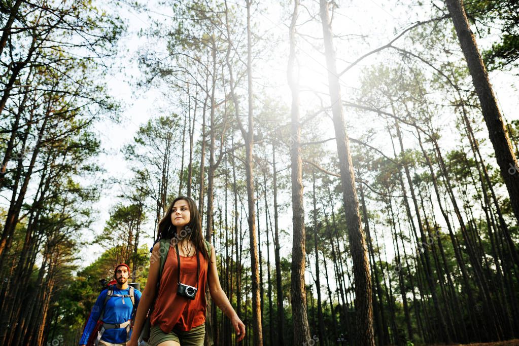 Young Friends Travelers in Forest