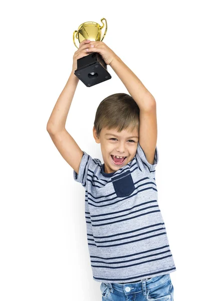 Chłopiec trzyma wygrywając Puchar — Zdjęcie stockowe