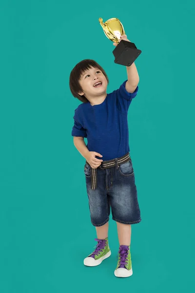 Boy holding Winning Cup — Stock Photo, Image