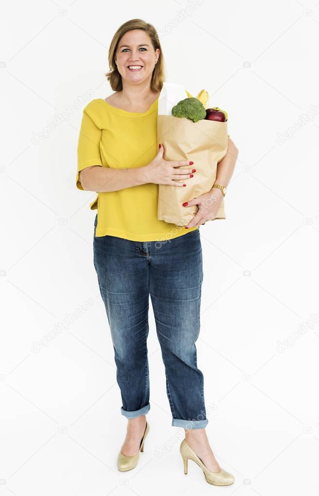 Woman carrying a bag of groceries