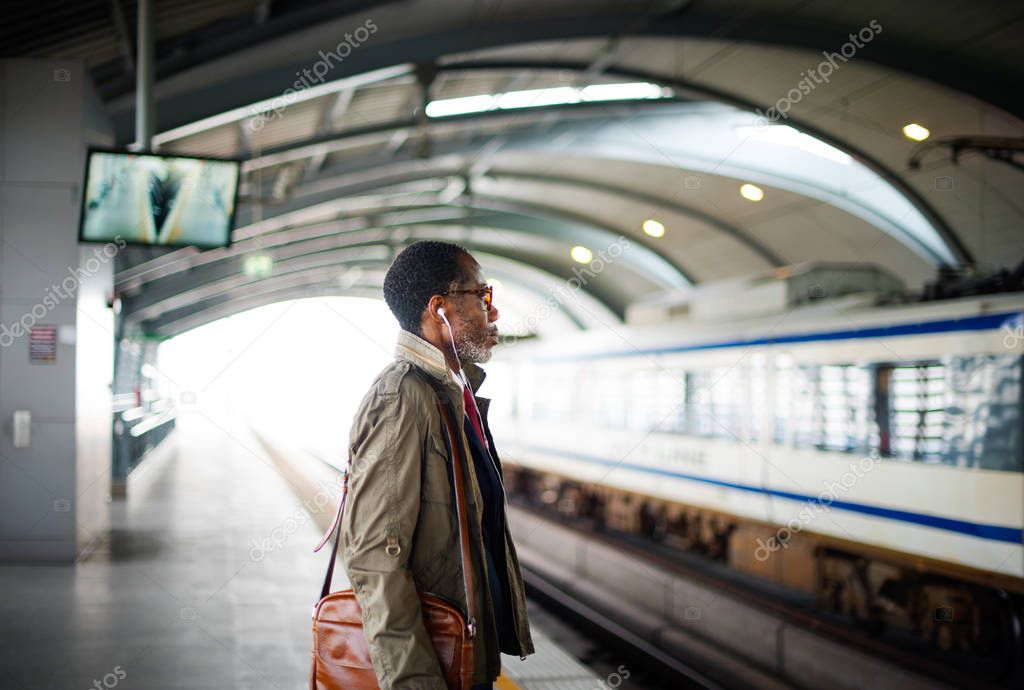 african man at railway station