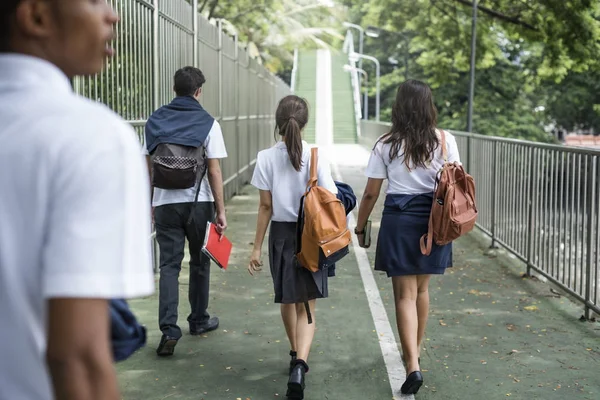 Student Friends walking together outdoors — Stock Photo, Image