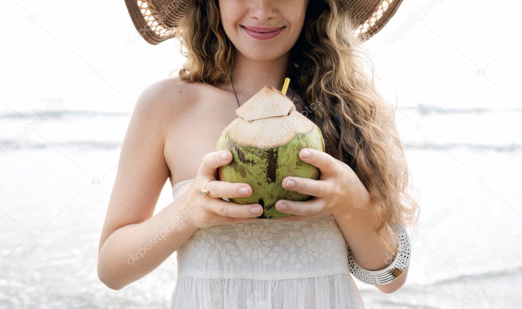 Girl drinking coconut coctail