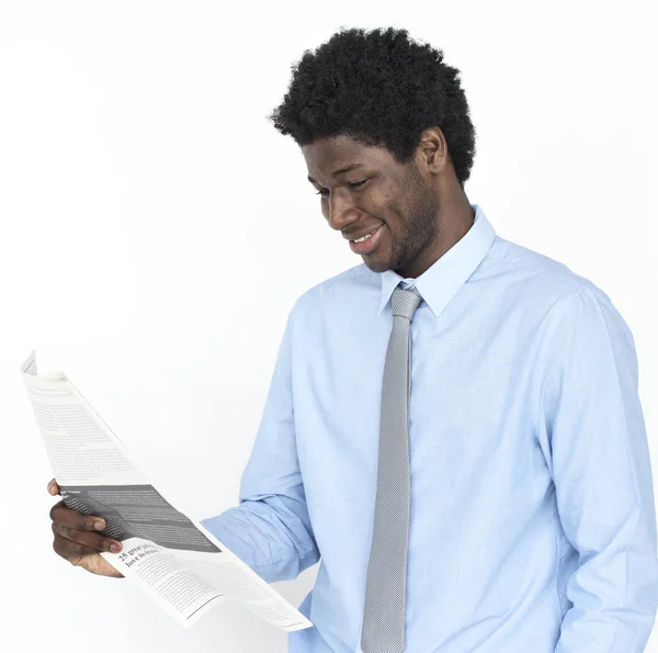 African Businessman reading newspaper — Stock Photo, Image
