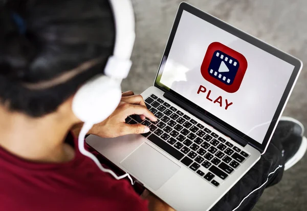 Man using laptop and listening musi — Stock Photo, Image