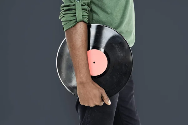 Man håller Vinyl skiva — Stockfoto