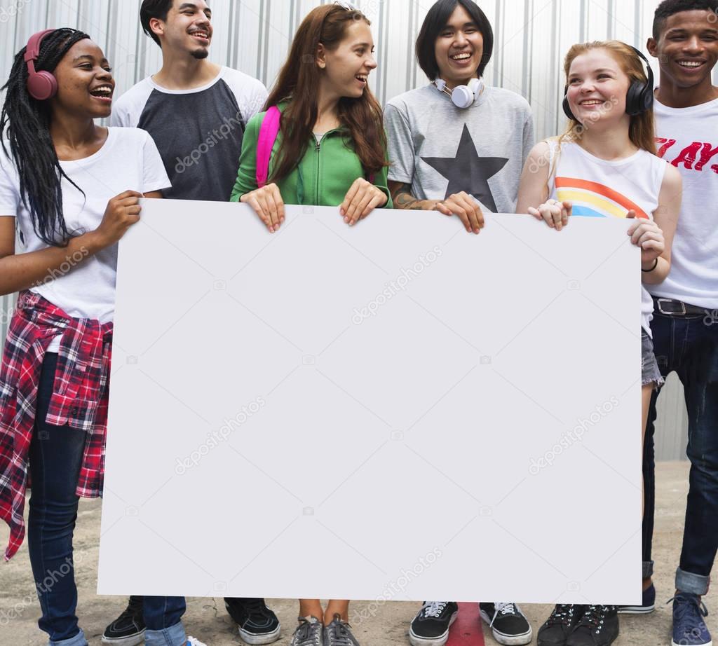 Teenagers Holding blank card