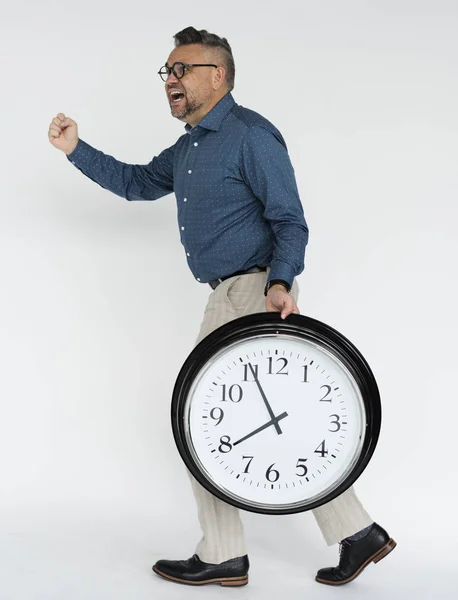 Empresario sosteniendo reloj —  Fotos de Stock