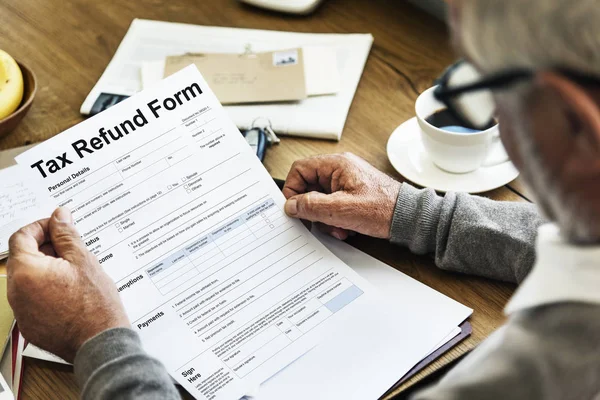 Man reading Tax Refund Form — Stock Photo, Image