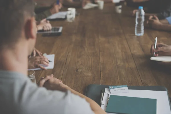 Diverse people on meeting table — Stock Photo, Image