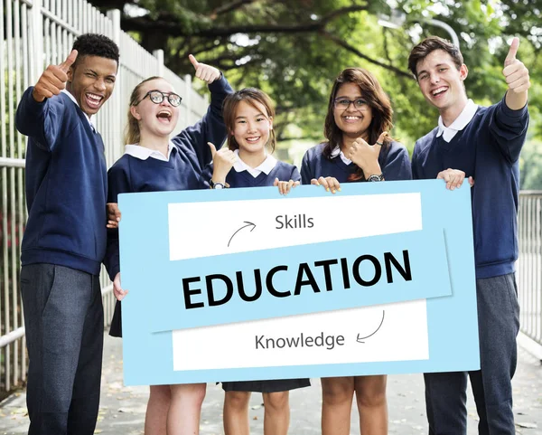 Students holding white board — Stock Photo, Image