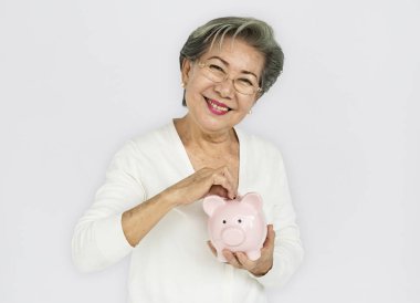 Woman Holding Piggy Bank clipart