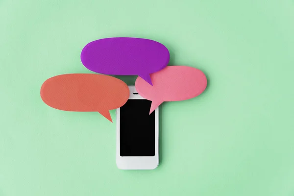 Smartphone with speech bubbles — Stock Photo, Image