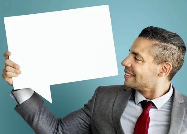 Businessman holding speech bubble — Stock Photo, Image