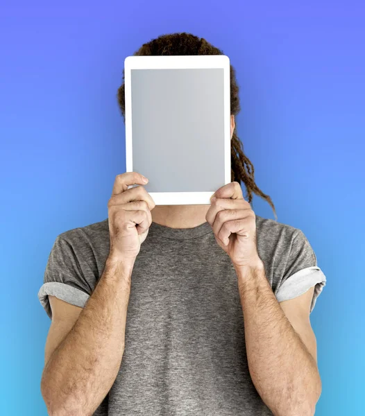 man Covering Face with Digital Tablet.