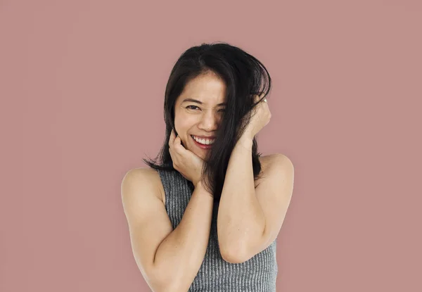 Asijské ženy dotýkal její obličej — Stock fotografie