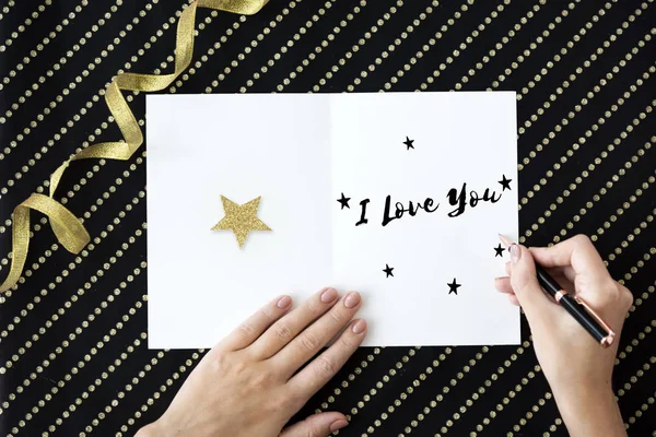 Person writing on greeting card — Stock Photo, Image