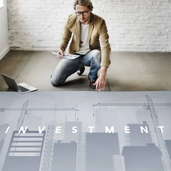 Businessman working near poster — Stock Photo, Image