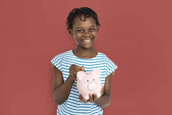 Menina segurando porquinho banco — Fotografia de Stock