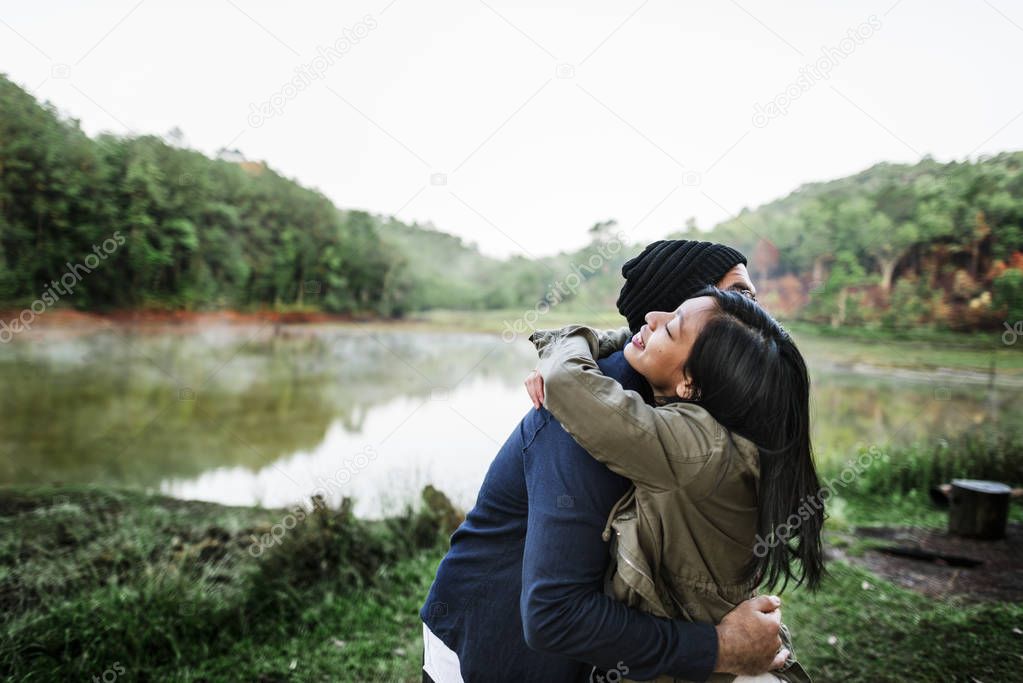 Couple hugging outdoors