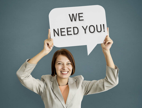 Businesswoman holding speech bubble