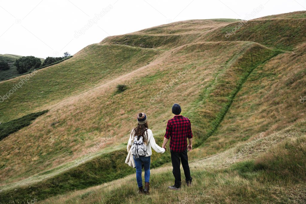 couple of hikers in mountains