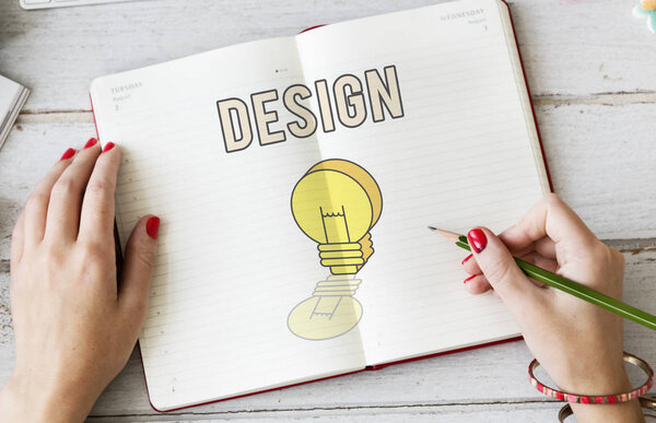 woman writing notes in diary