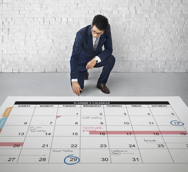 Businessman working with planner — Stock Photo, Image