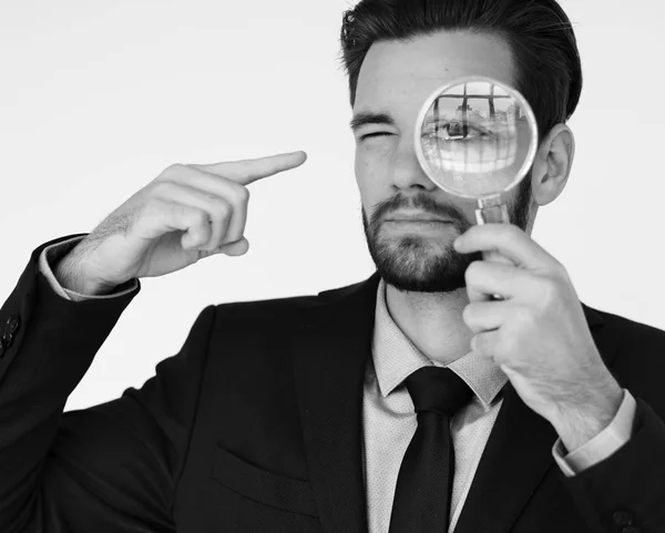 Businessman magnifying glass — Stock Photo, Image