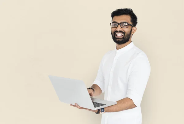 Happy Indian man holding laptop — Stock Photo, Image