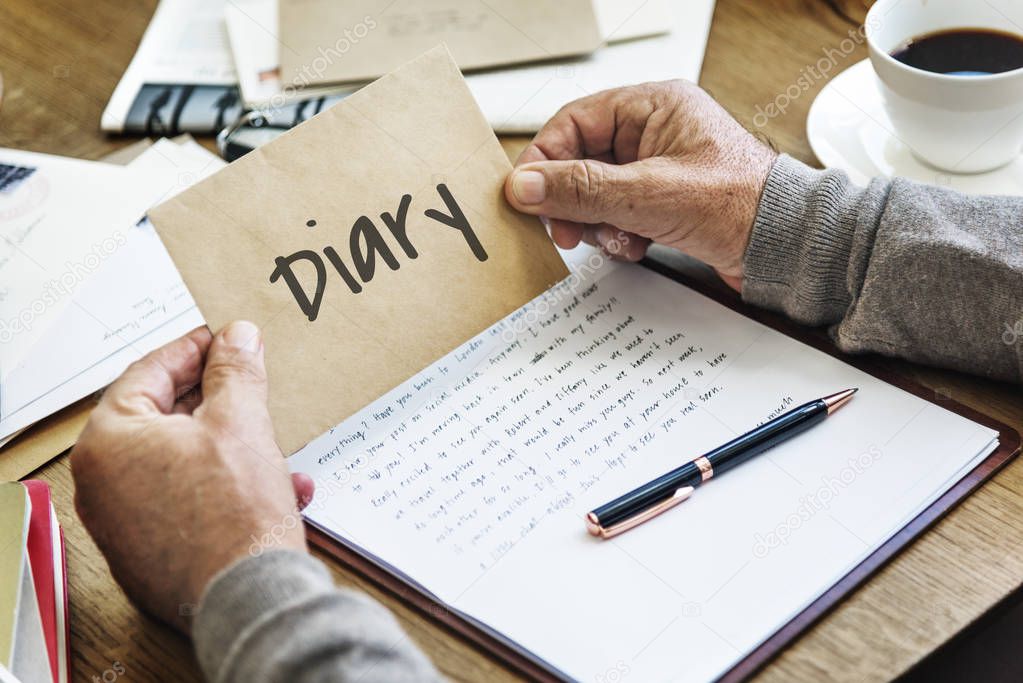 man holding kraft envelope