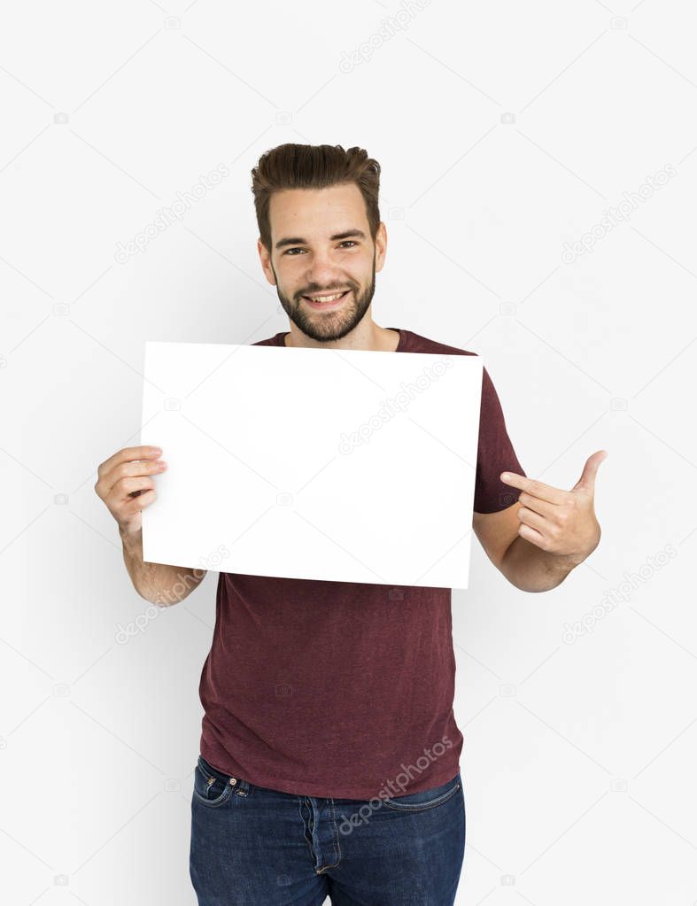 man showing paper blank and smiling