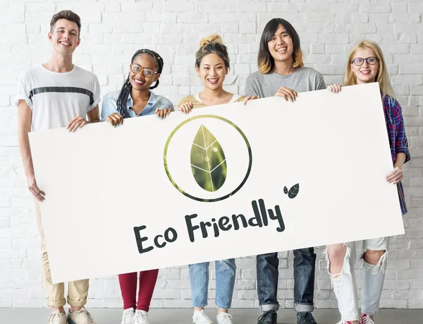 Students holding informational board — Stock Photo, Image