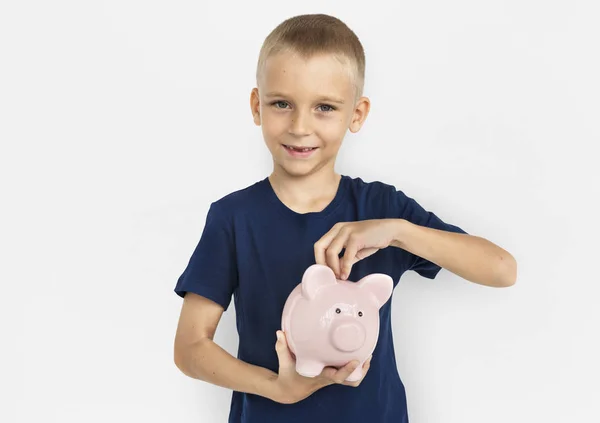 Piggybank を持った少年 — ストック写真