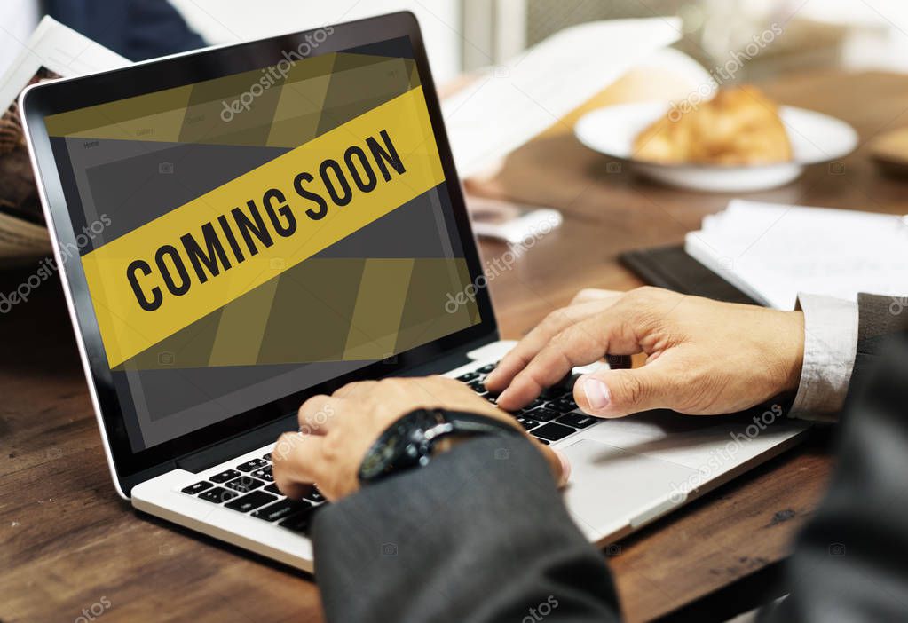 Businessman typing on laptop. Business Concept. Concept Coming Soon